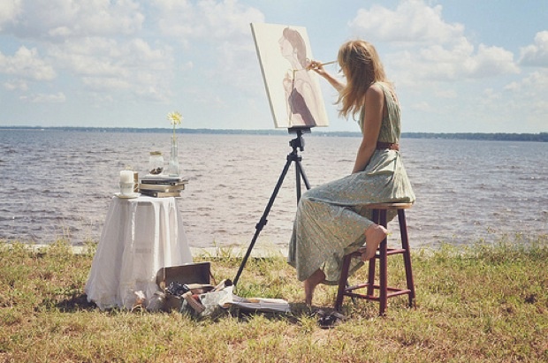 image of a women painting