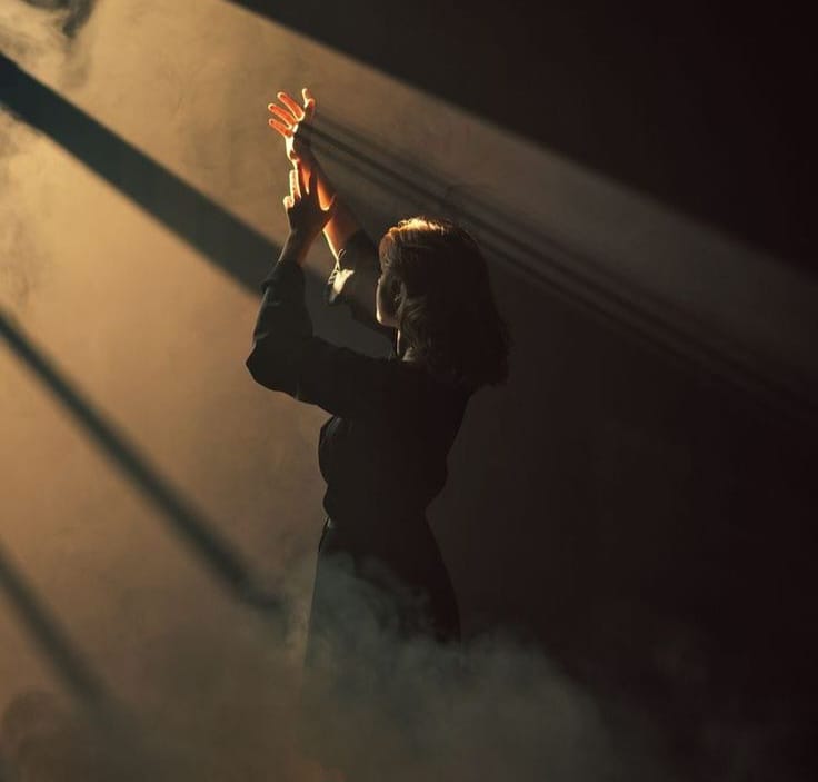 image of a woman seeking light.